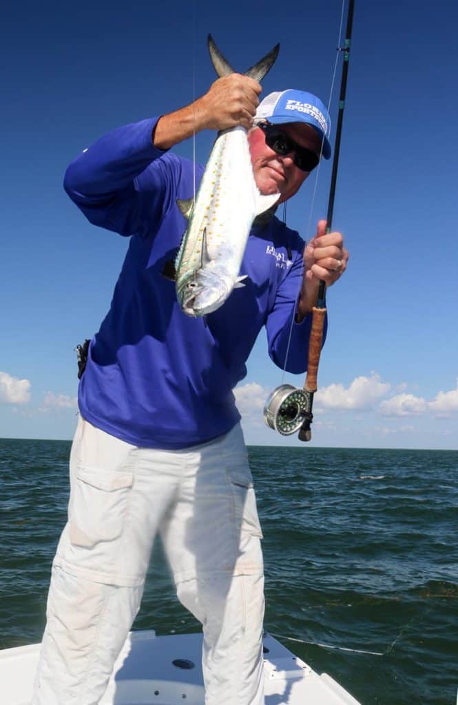 Mike Conner lands a Spanish mackerel on fly