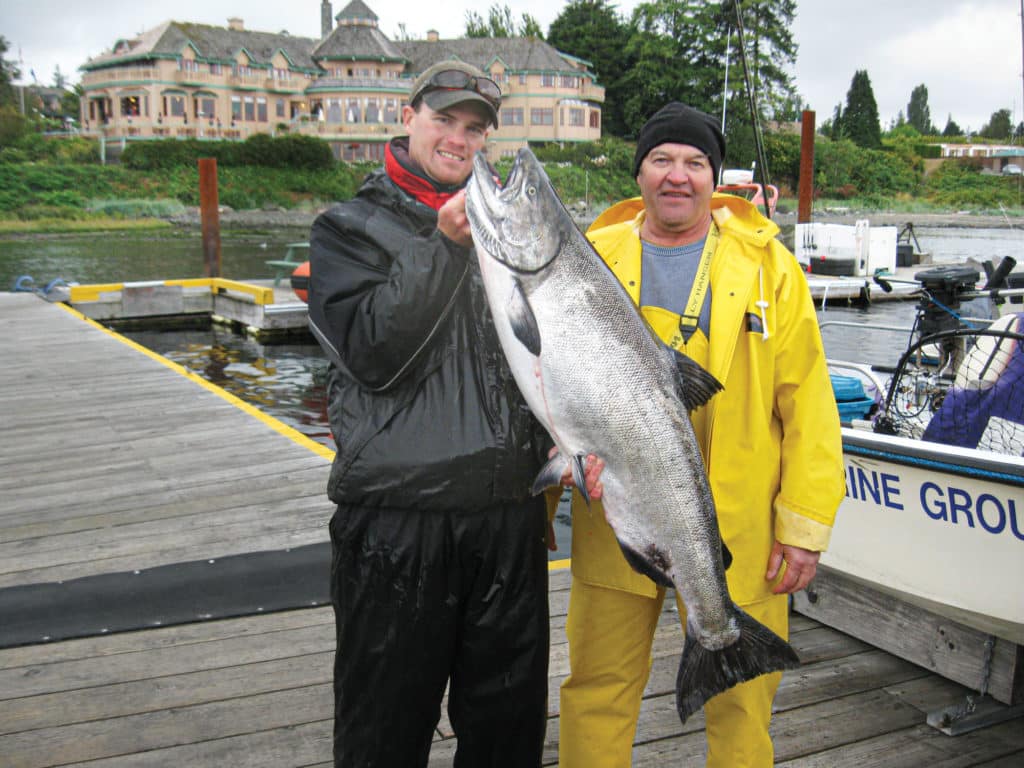 Holding up a nice salmon on the dock