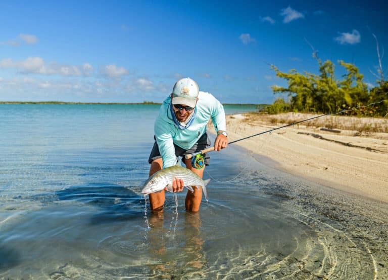 Holding up a bonefish caught on the flats
