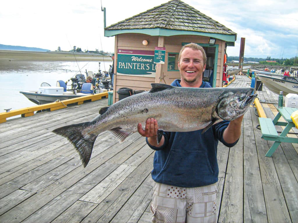 Large salmon held up for the camera