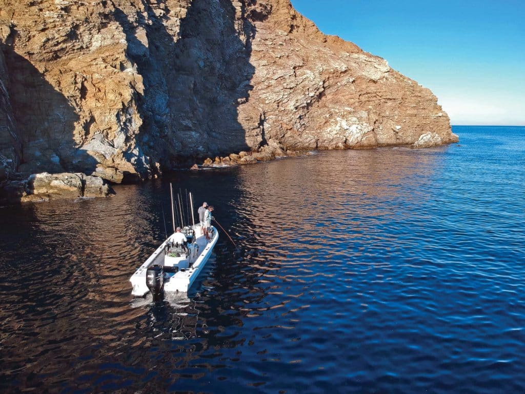 Fishing from a bay boat over structure