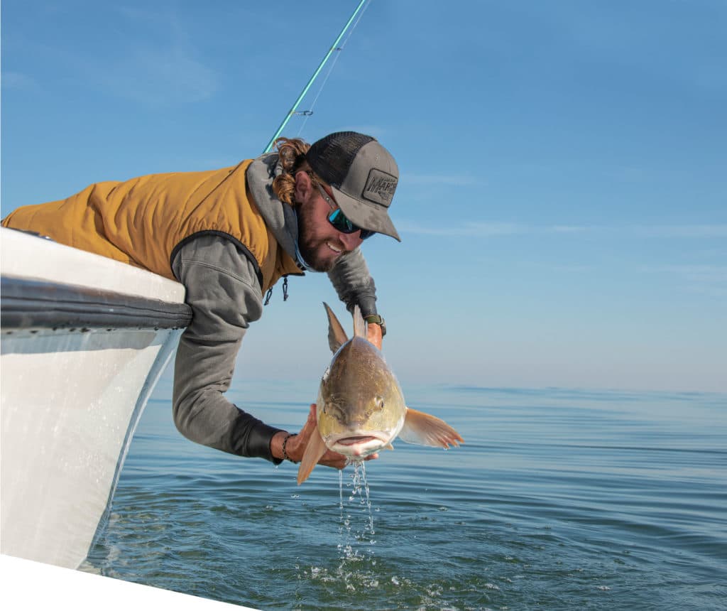 Bull redfish brought boatside