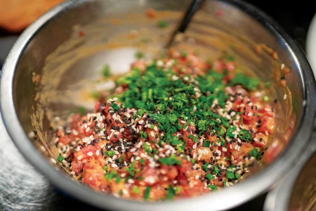 Diced yellowfin tuna in a mixing bowl