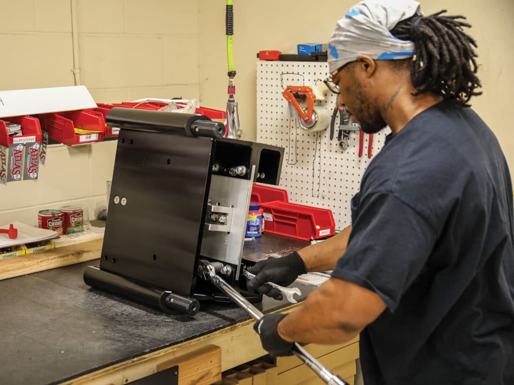 Technician assembling a jack plate