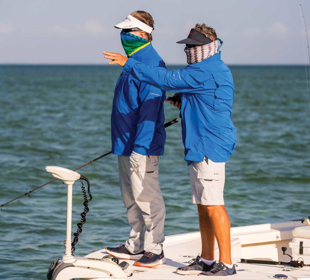 Pointing out bonefish on the flats