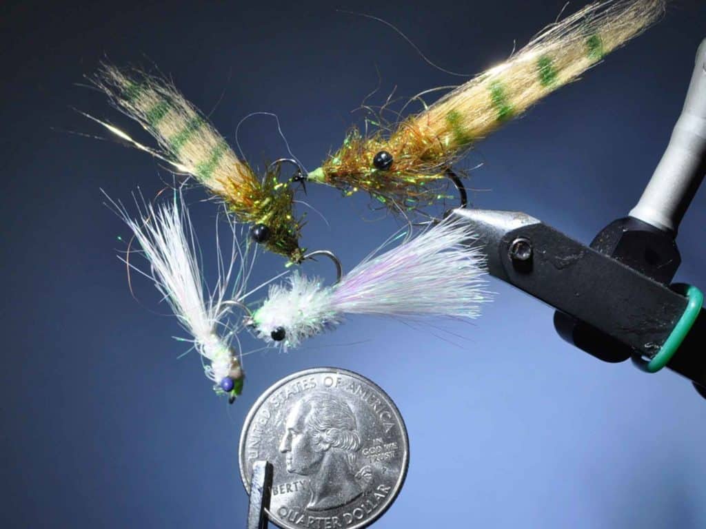Small and sparkly shrimp and baitfish flies are tailor made for dock-light fishing