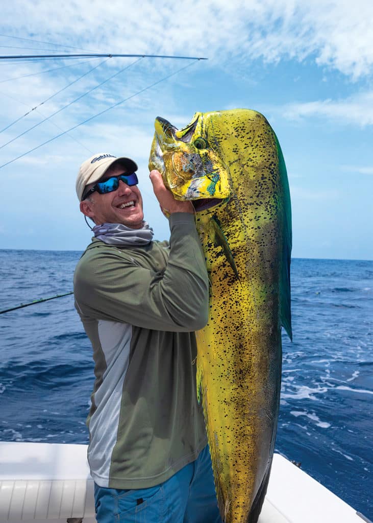 Angler holding up dolphin