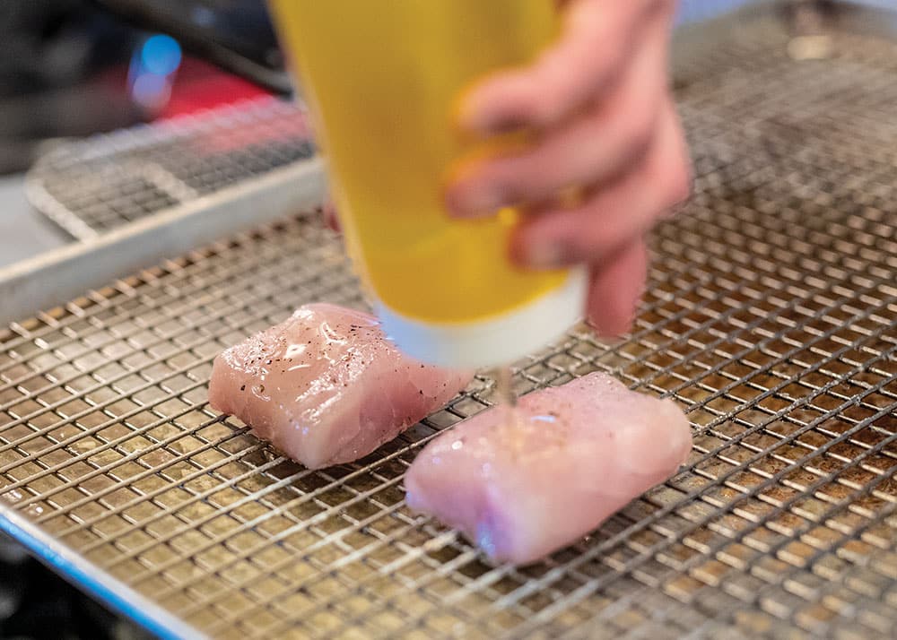 Season the grouper fillets with olive oil, and salt and pepper to taste before grilling.