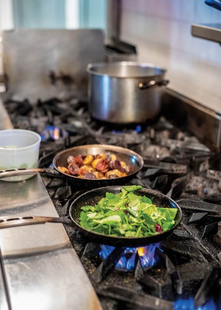 Once you cook the shallot, garlic and chile flakes with oil, cook the kale a ­little at a time until tender.