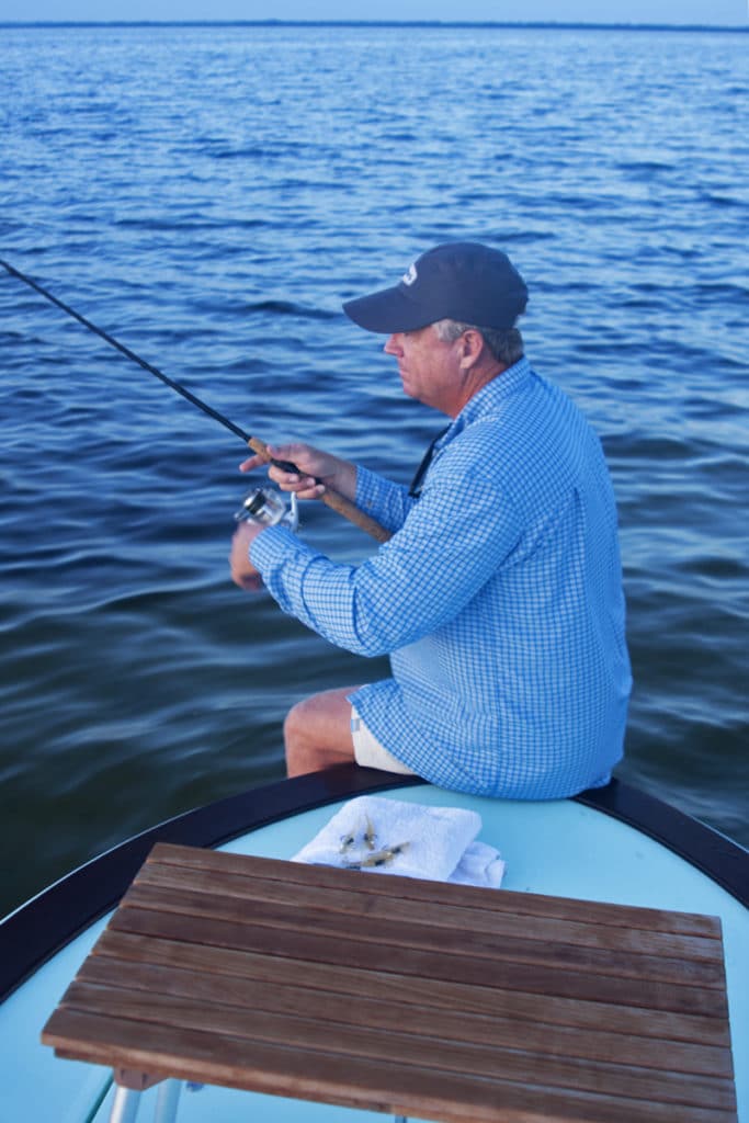 Benson's stealthy approach involves pulling the skiff forward by sitting on the bow and walking across the bottom.