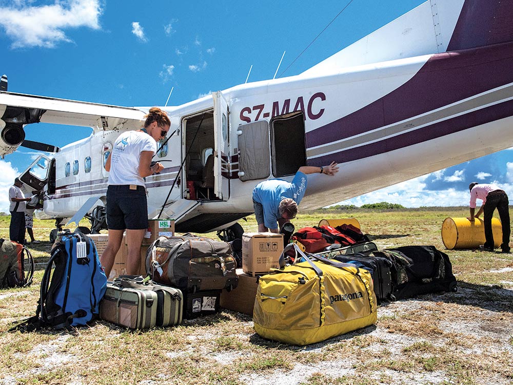 loading bags on a plane