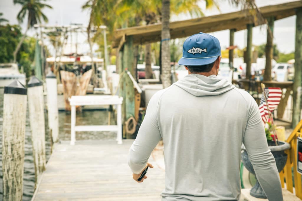 Wearing HUK gear and walking the dock