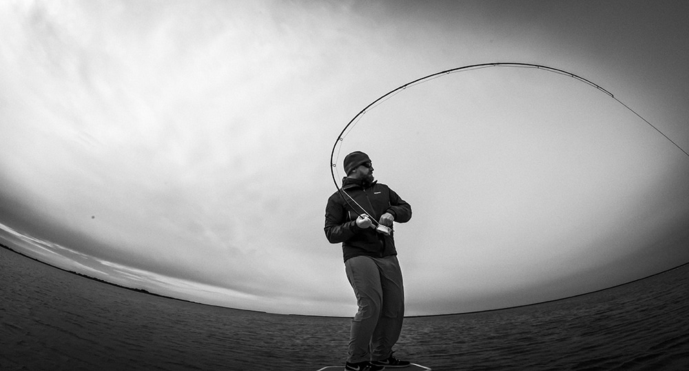 Fly angler battles a big bull redfish