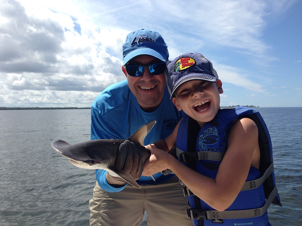 kid catches shark