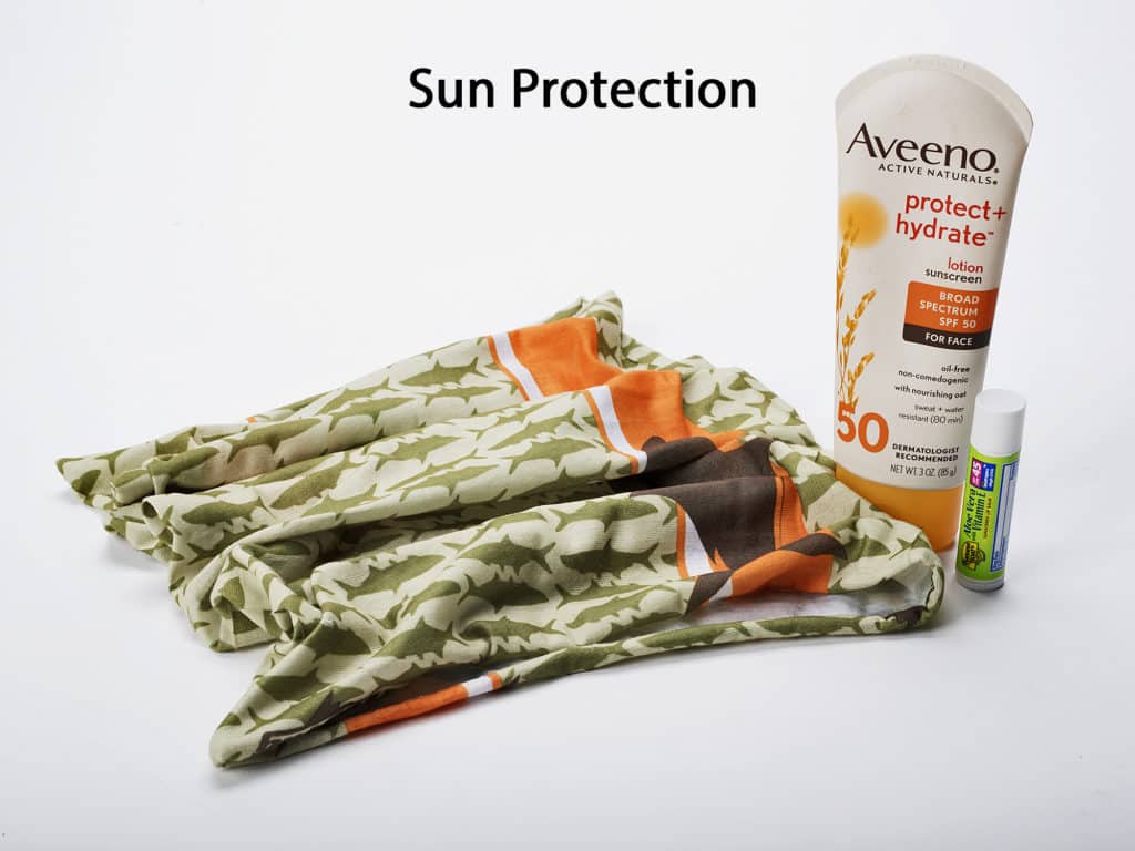 Pack a Buff or similar stretchable face mask to protect your face, and lip balm and a good, sweat-proof sunscreen of 30 SPF or higher.