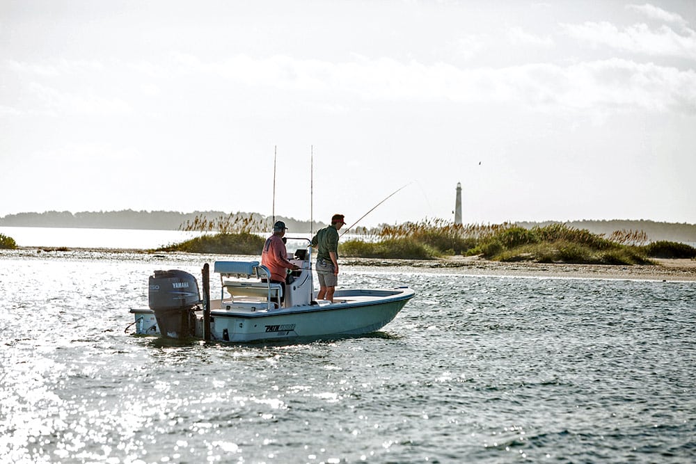 Anglers aboard a bay boat look for fish near Cape Lookout, North Carolina.