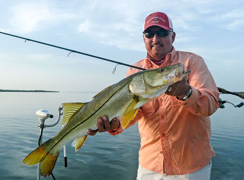 SWS Senior Editor Ales Suescun holds up a large Southwest Florida snook.