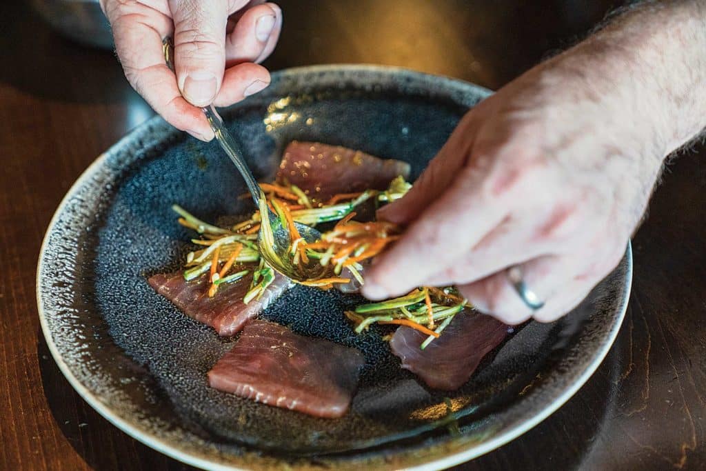 Plating the tuna crudo