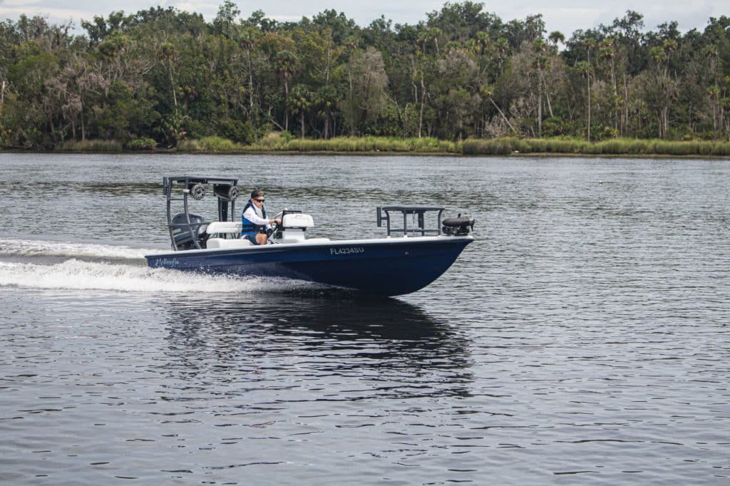 Yellowfin 17 CE cruising on a river