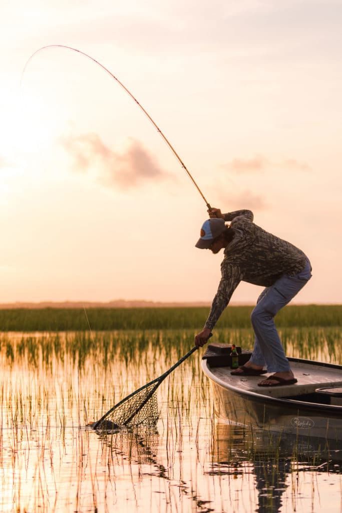 Angler netting fish