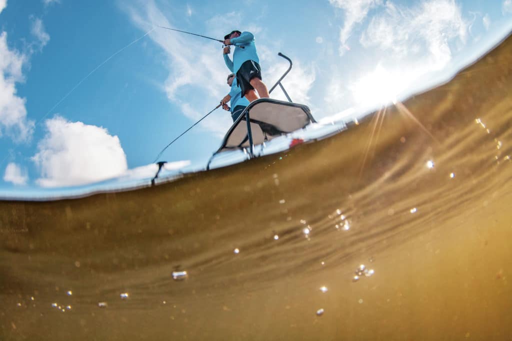 Angler fishing from poling tower