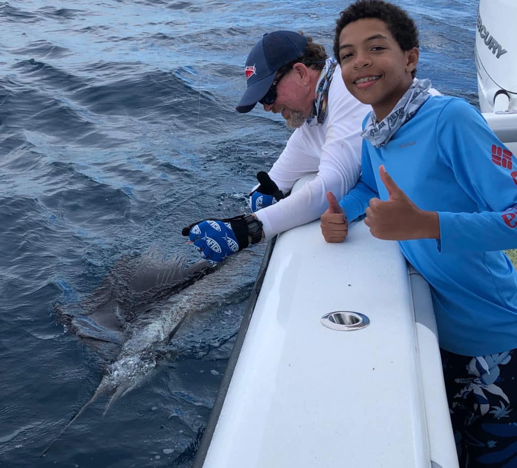 Sailfish brought next to boat