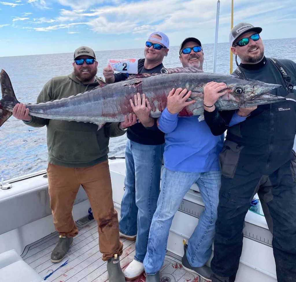 Reel Labor team holding up giant wahoo