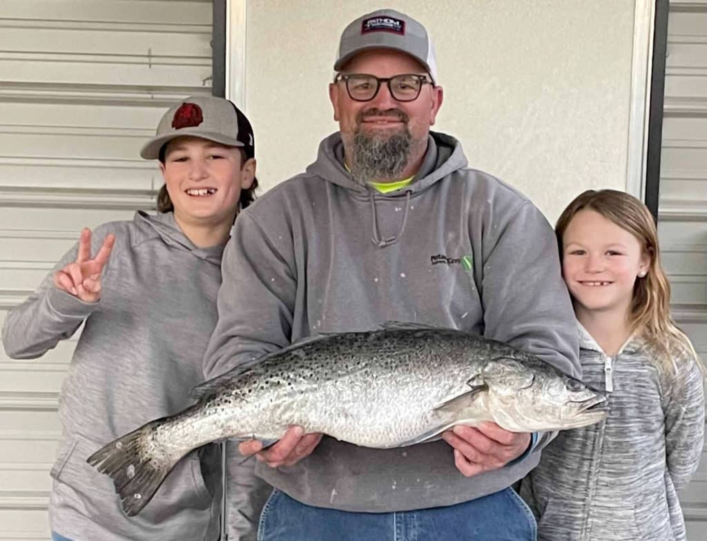 Todd Spangler with kids and sea trout