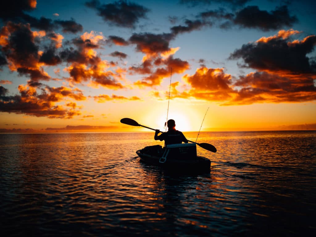 Kayak angler at sunset