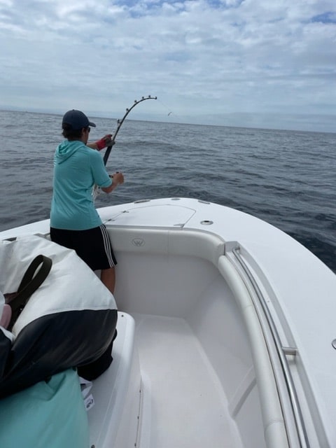 angler reeling in tuna