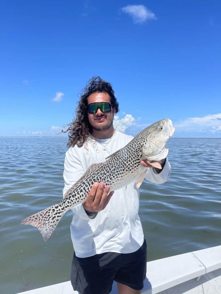 angler Ryan Hernandez with leopard redfish