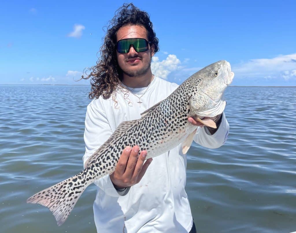 angler Ryan Hernandez with leopard redfish