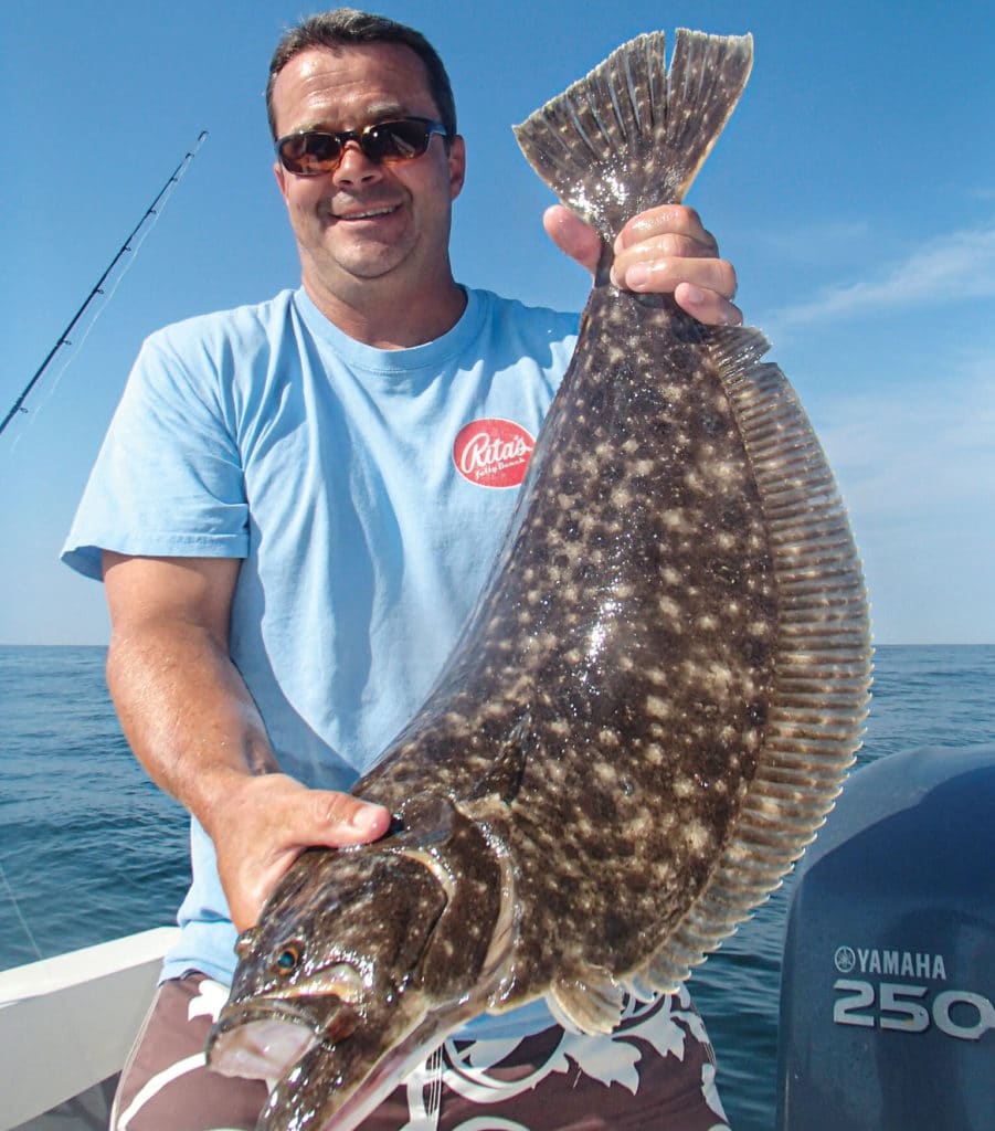 Holding up a nice flounder