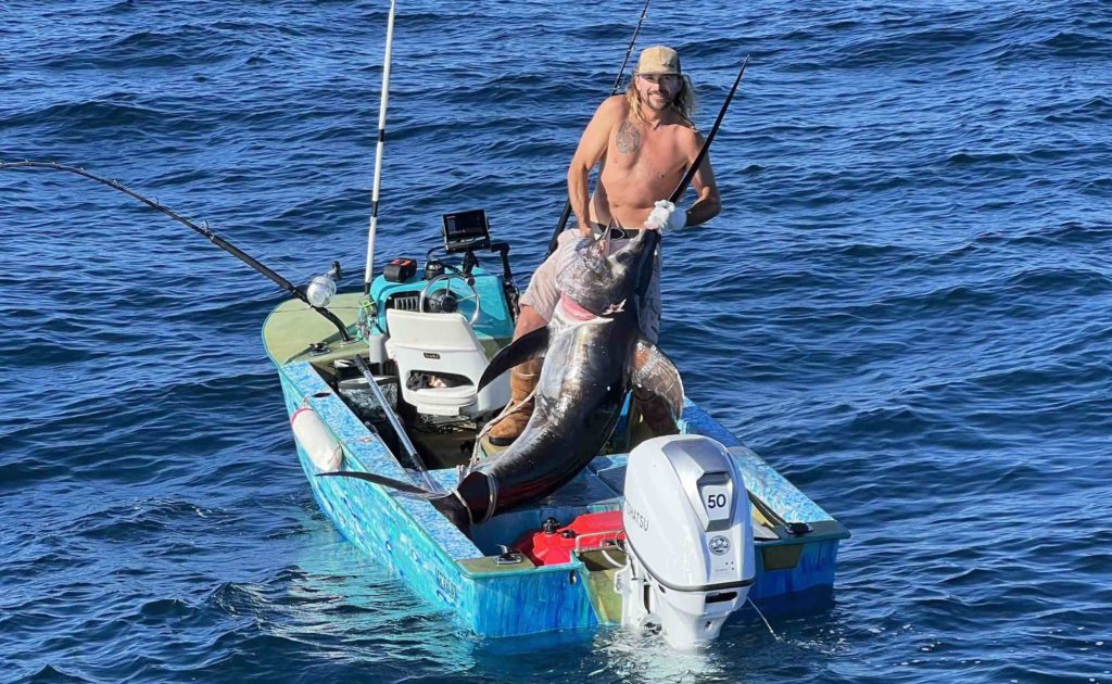 Big Swordfish on a Tiny Boat