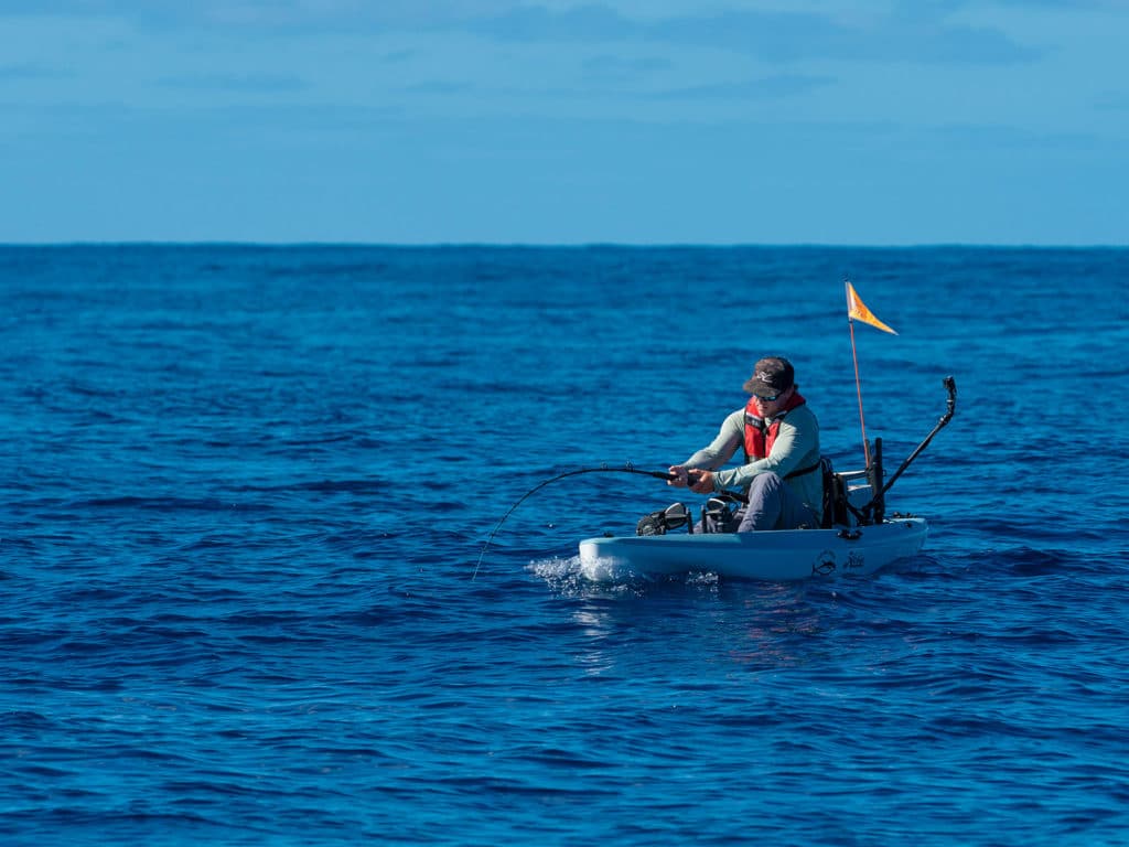 fighting a big fish from a kayak