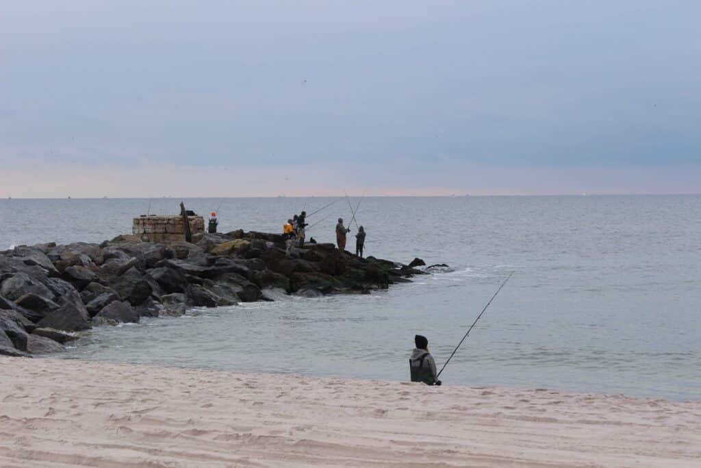 fishermen on a jetty