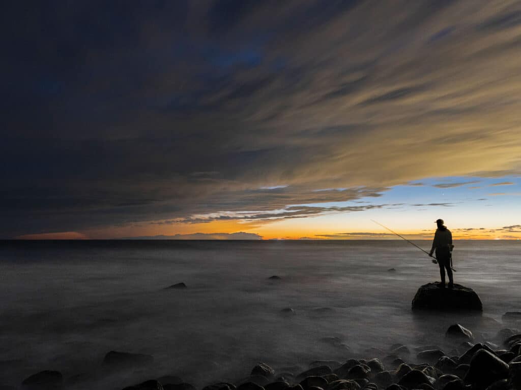 Angler on the rocks