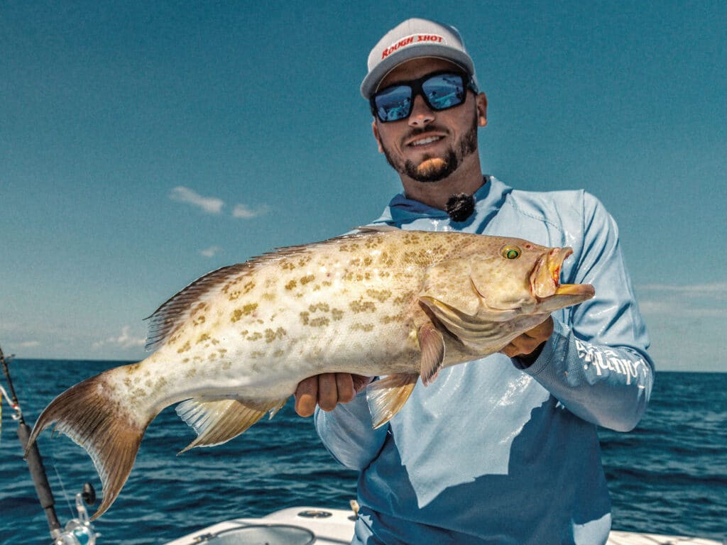 Angler with scamp grouper