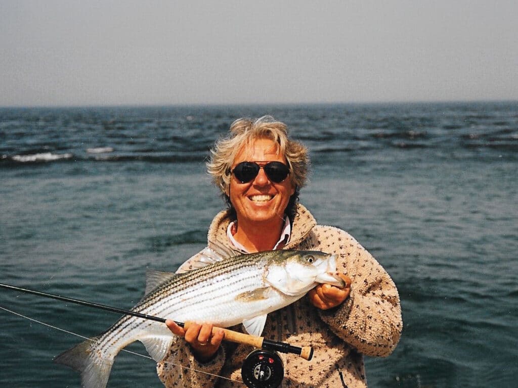 Angler with a striped bass