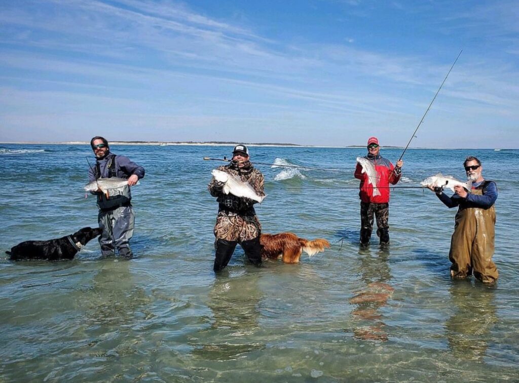 surf anglers with redfish