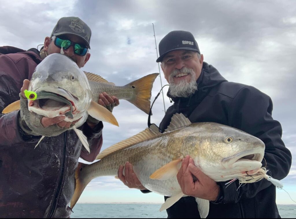 anglers with trophy redfish