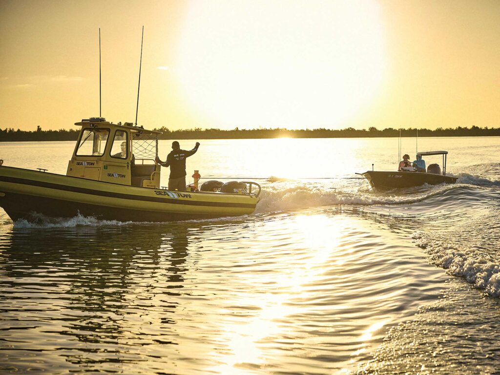 Boat being towed by Sea Tow