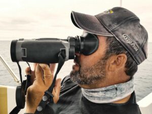 Angler using gyrostabilized binoculars