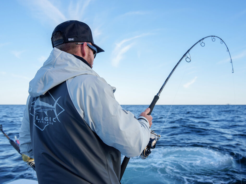 Angler catching a fish using popping tackle