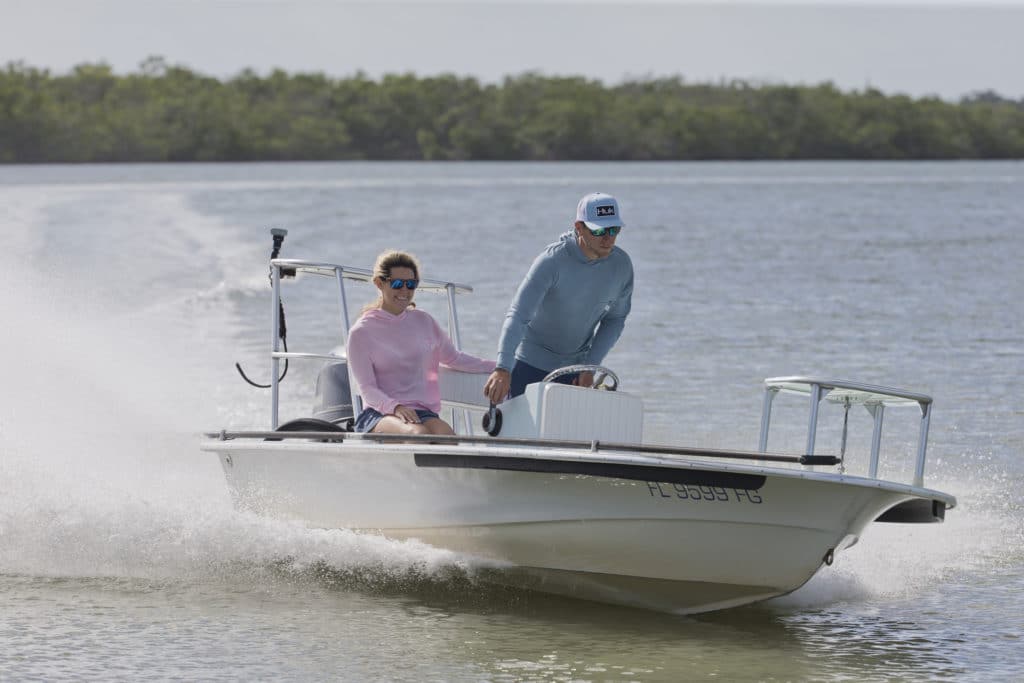 Anglers wearing HUK gear on flats boat
