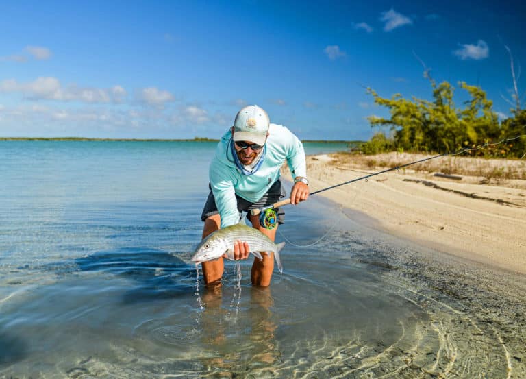 Holding up a bonefish caught on the flats