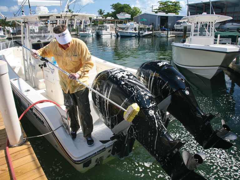 SWS0522-BT-washing-boat Washing outboard motors in marina