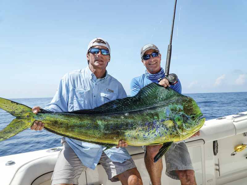SWS0722-Keys-Dolphin-1 Anglers holding up a large mahi