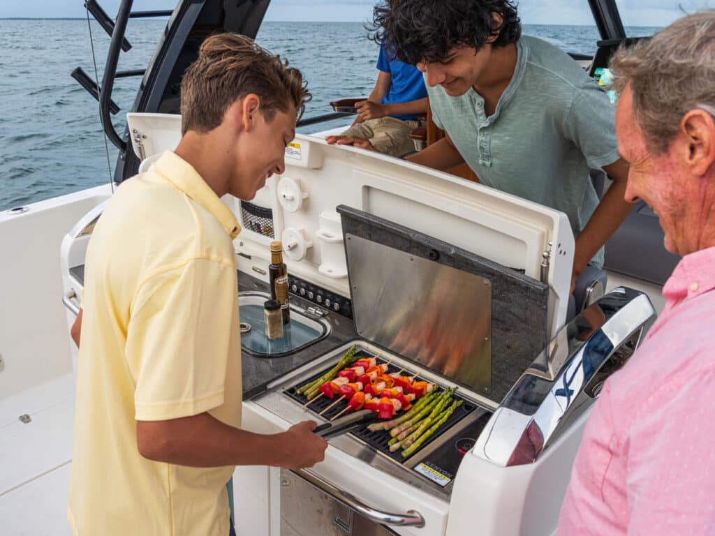 Boaters grilling on boat