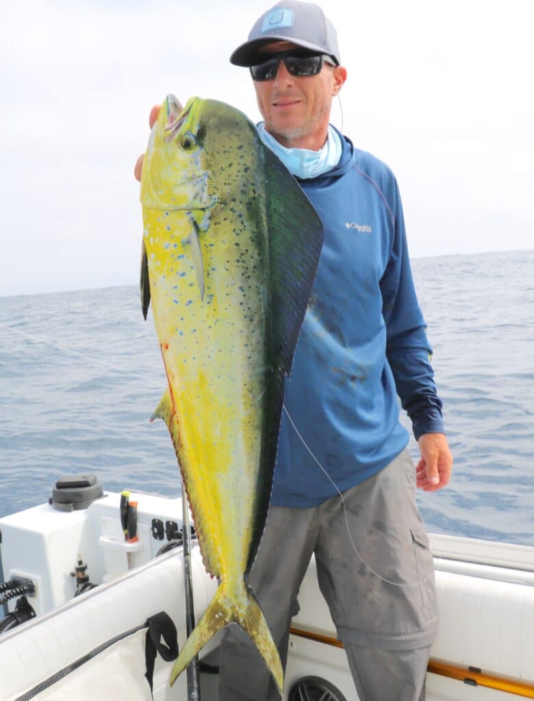 angler with mahi